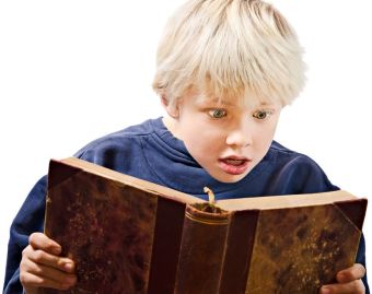 11817949 - young boy reading excited in an old book